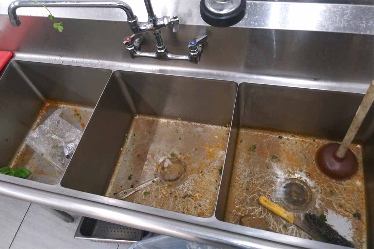 Clogged Sink Restaurant Kitchen. How to Properly Clean Drains With Grease. Hydro Jetting is Can Successfully Eliminate All Blockages In The Pipelines.