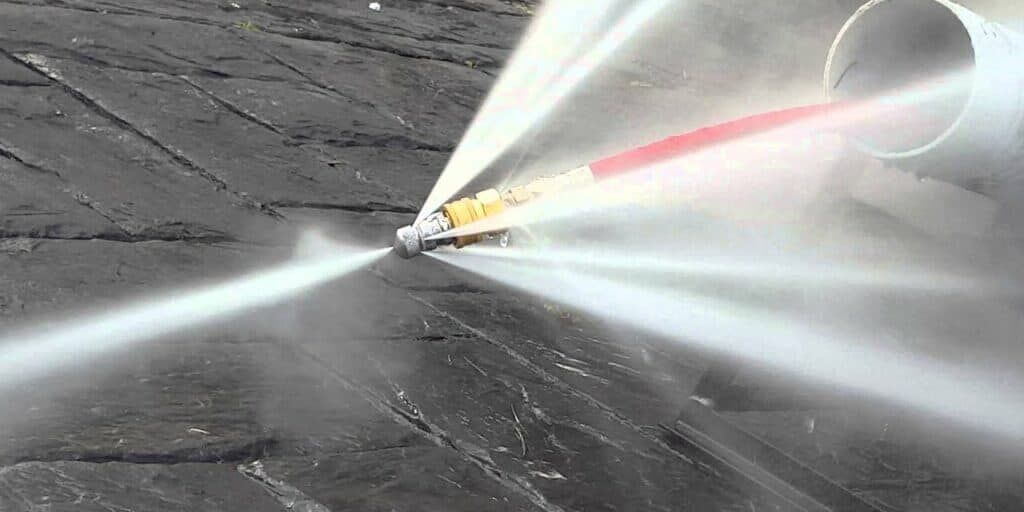 Hydro jetting hose in action by The Grease Company for commercial kitchen drain cleaning