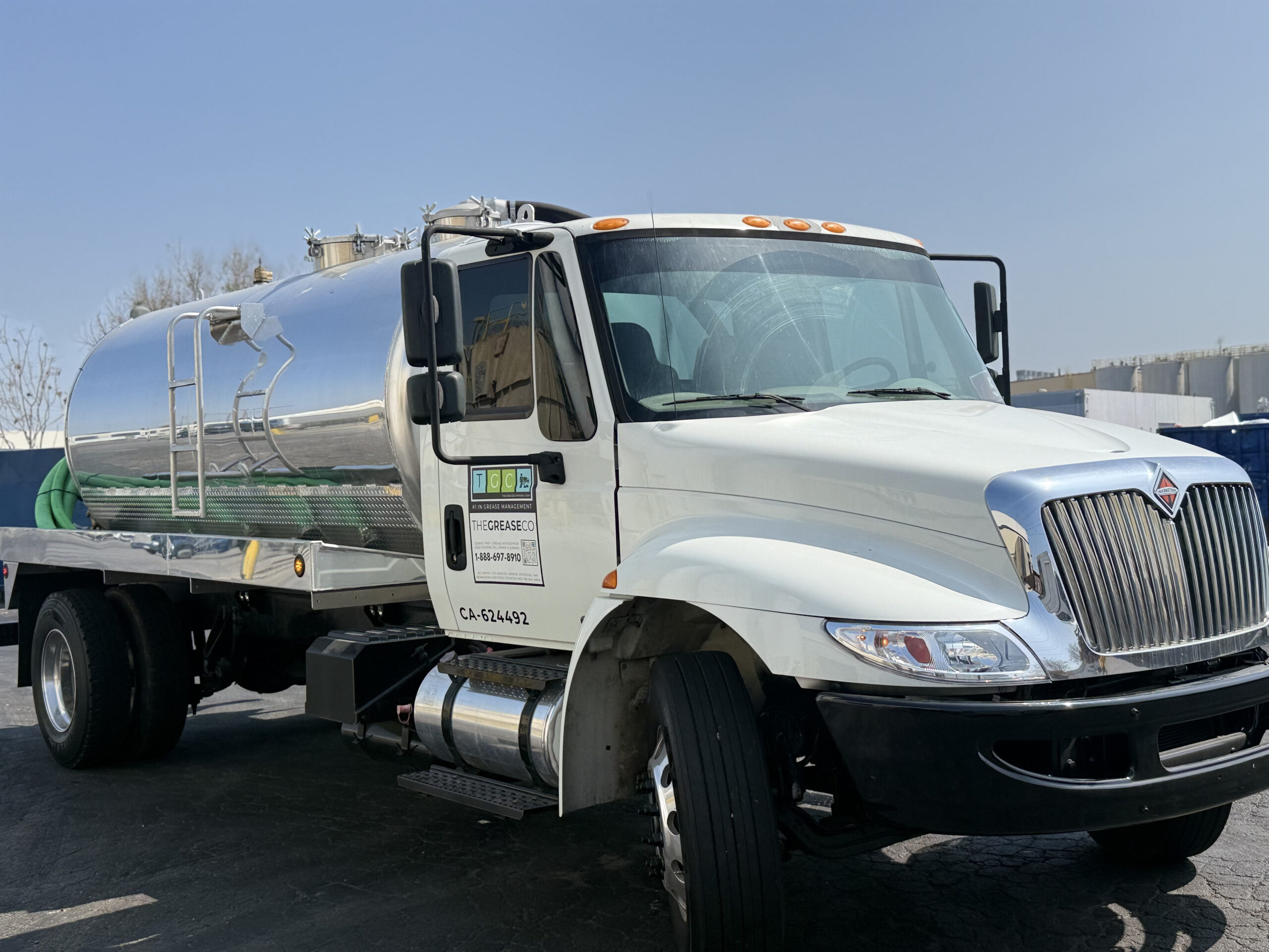 Grease collection truck collecting used cooking oil from restaurants in Southern California