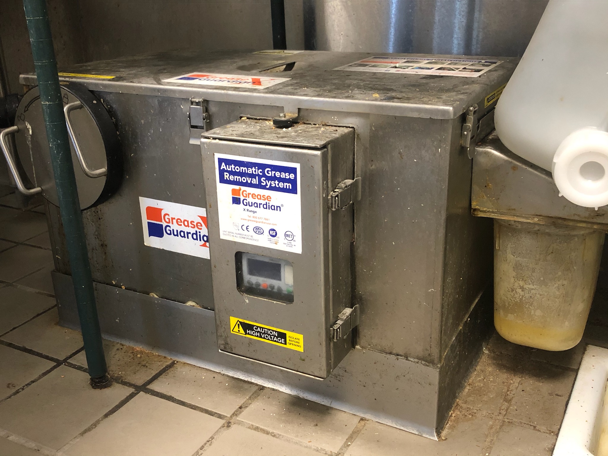 Grease trap installed in restaurant kitchen under sink