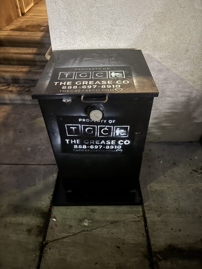 Full commercial grease trap awaiting restaurant grease trap repair service by The Grease Company