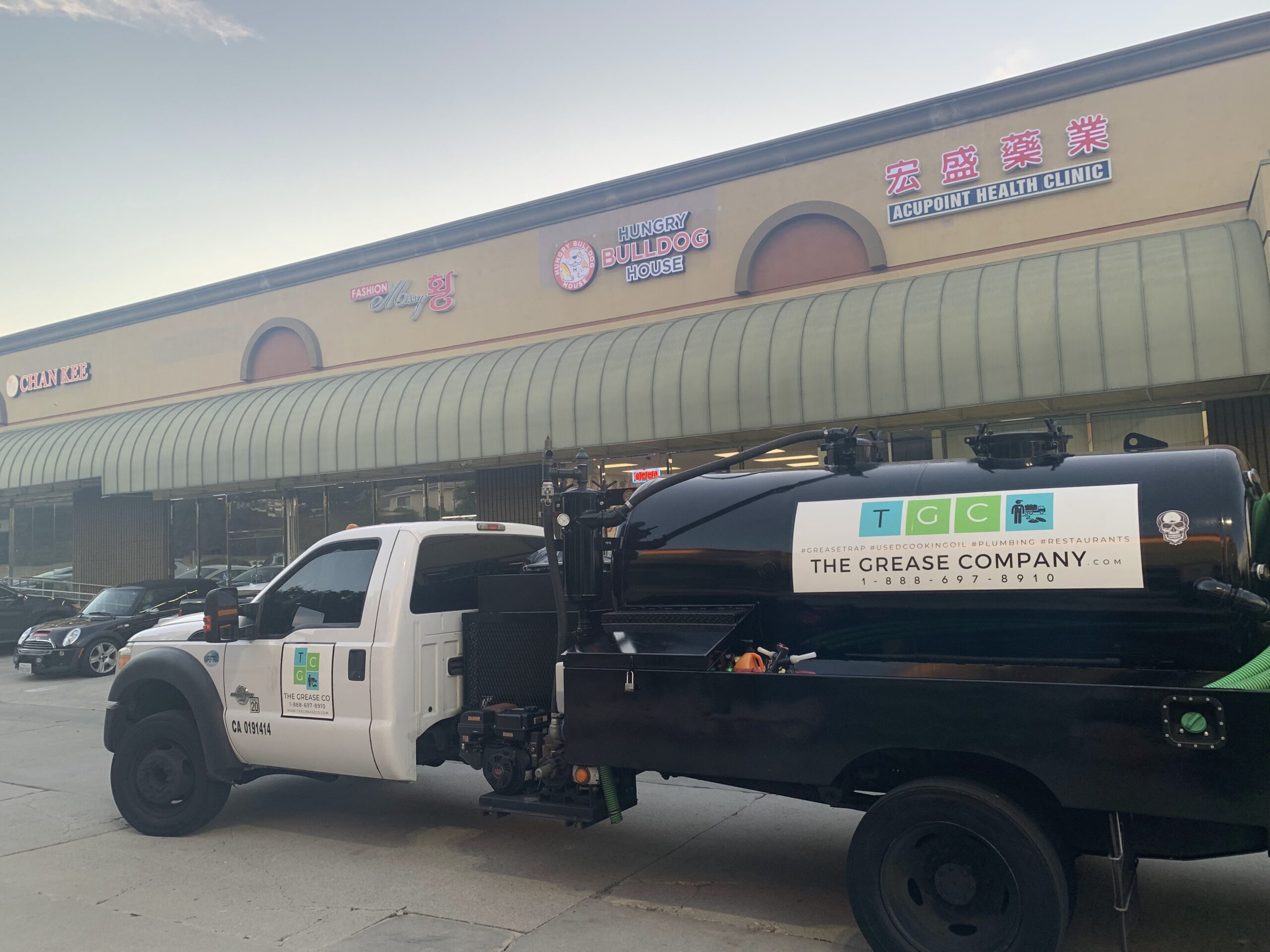 Grease Company service truck providing commercial grease trap repair and maintenance services