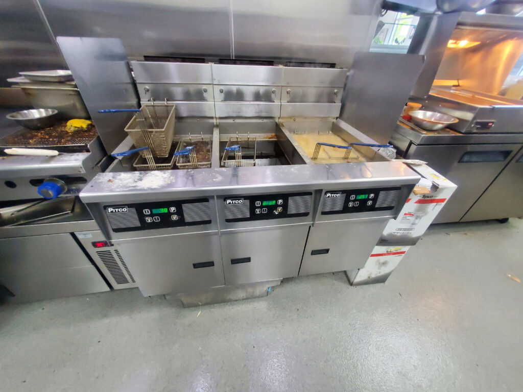 Clean commercial kitchen floor after professional grease spill clean up service by The Grease Company.