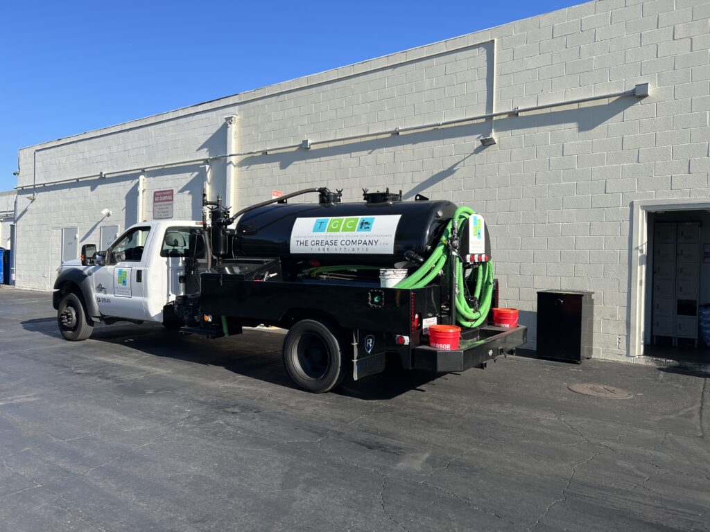 The Grease Company service truck providing grease trap odor control and commercial grease trap cleaning services for restaurants.