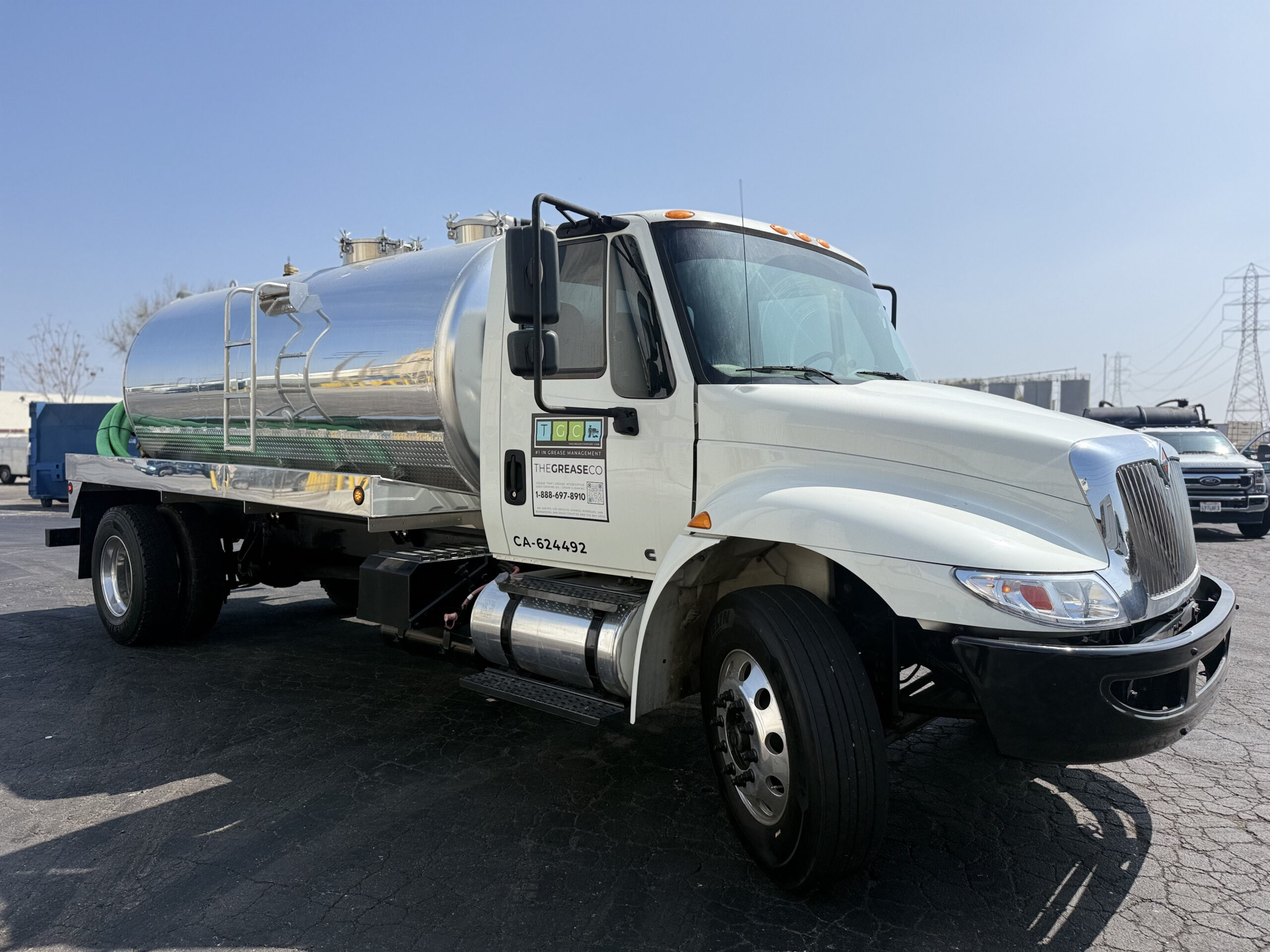 Grease Company truck transporting expired food-grade cooking oil for recycling