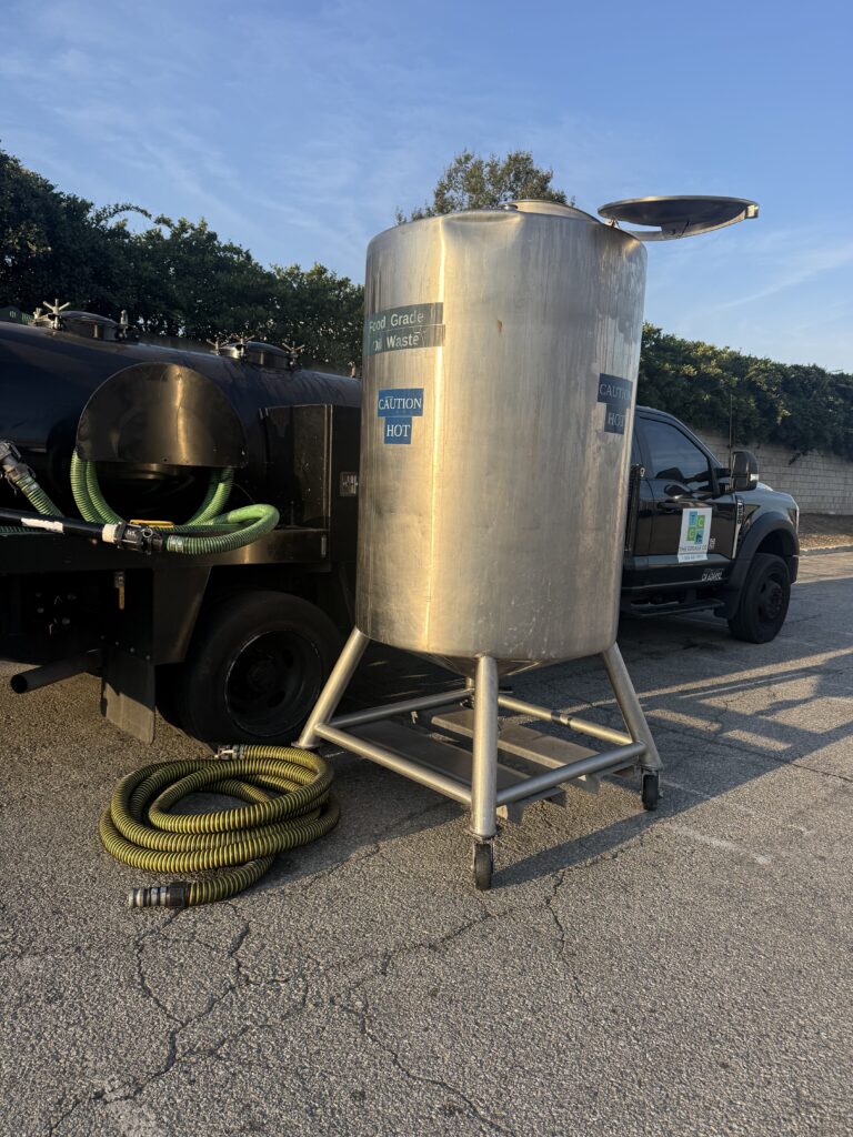 Used cooking oil container under a restaurant grease recycling program